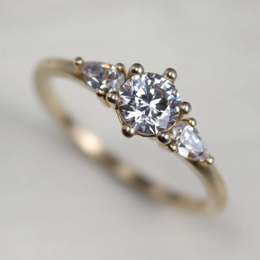 5mm Prong-set Three Stone Ring with Pear-Shaped Side Stones •